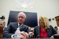 Sara Nelson with the Association of Flight Attendants-CWA, right, speaks with Captain Chesley "Sully" Sullenberger left, before a House Committee on Transportation and Infrastructure hearing on the status of the Boeing 737 MAX on Capitol Hill in Washington, Wednesday, June 19, 2019. (AP Photo/Andrew Harnik)