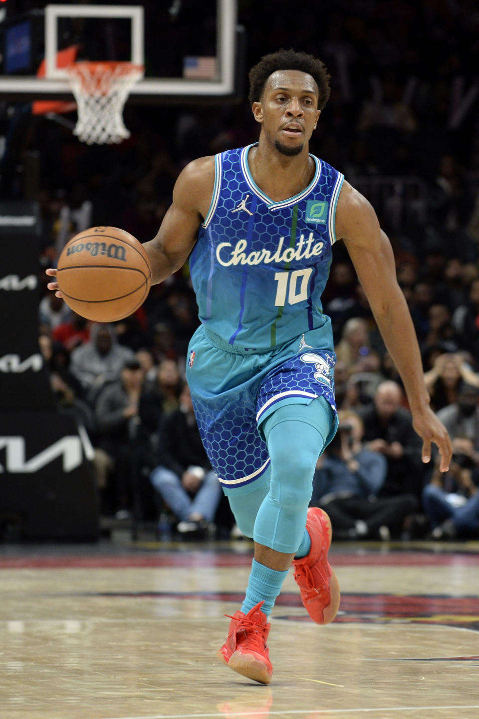 Charlotte Hornets guard Ish Smith dribbles downcourt during the second half of an NBA basketball game against the Atlanta Hawks on Sunday, Dec. 5, 2021, in Atlanta. (AP Photo/Edward M. Pio Roda)