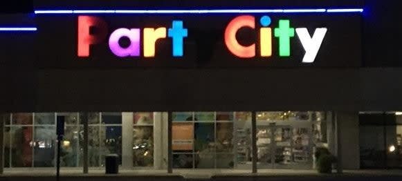 Party City store with partially burnt out P so it looks like it says "Fart city"