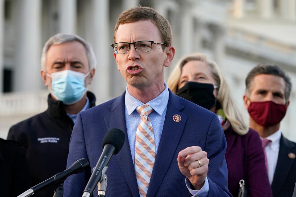 Rep. Dusty Johnson, R-S.D., speaks during a news conference with the Problem Solvers Caucus Monday, Dec. 21, 2020, on Capitol Hill in Washington.