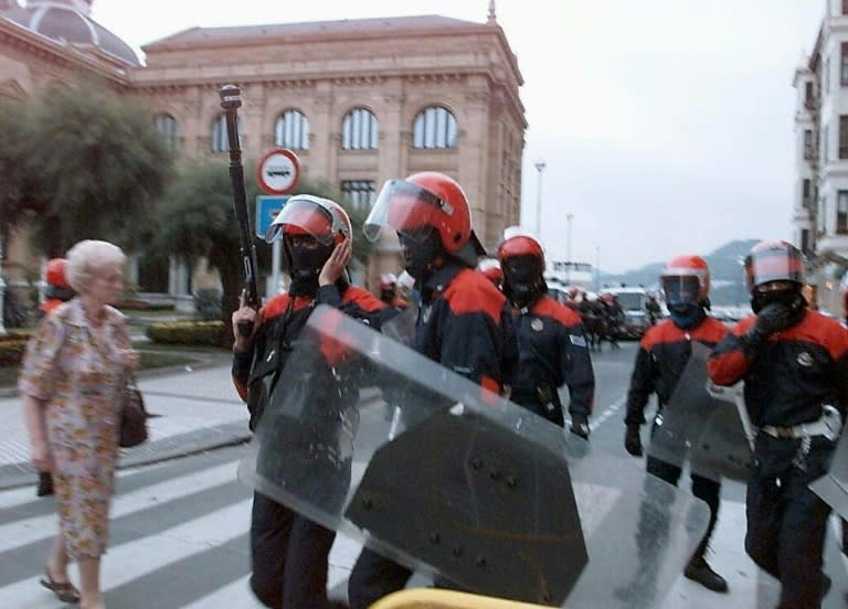 Basque policemen patrol a street of San Sebastian's old town in 1997 after the funeral of Miguel Angel Blanco, who was assassinated by the military independantist basque movement ETA