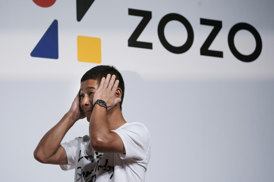 Zozo founder, Yusaku Maezawa, gets emotional as he speaks during a news conference Thursday, Sept. 12, 2019, in Tokyo. Yahoo Japan Corp. said Thursday it will put up a tender offer, estimated at 400 billion yen ($3.7 billion), for Zozo Inc., a Japanese online retailer started by a celebrity tycoon. (AP Photo/Jae C. Hong)