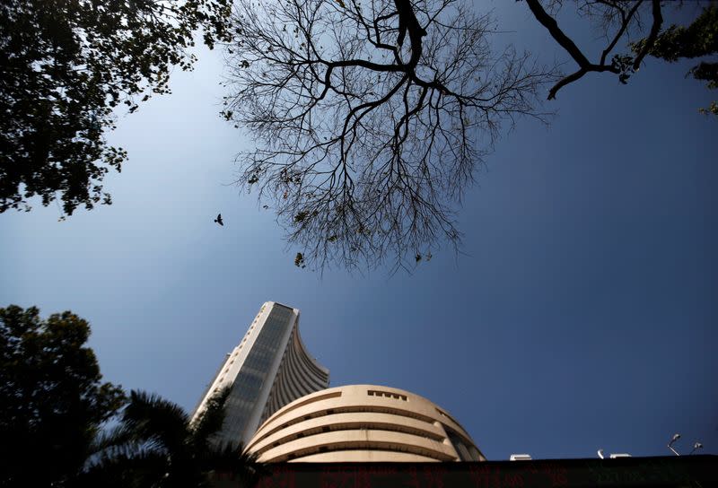 A bird flies past the Bombay Stock Exchange building in Mumbai