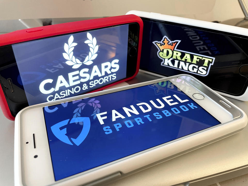 Photo by: STRF/STAR MAX/IPx 2022 1/7/22 New York online sports betting to launch on Saturday, January 8th. Fanduel, Caesars, Draftkings and Rush Street Interactive have met the regulatory requirements to launch this weekend. Here, Caesars, Draft Kings and Fanduel logos photographed on multiple iphone devices.