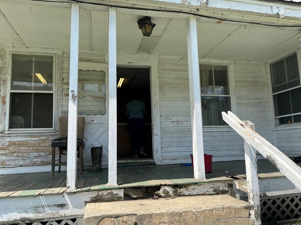 The porch of the farmhouse will be rebuilt as part of the renovations made possible by the housing repair loan program, as seen on May 12, 2023.