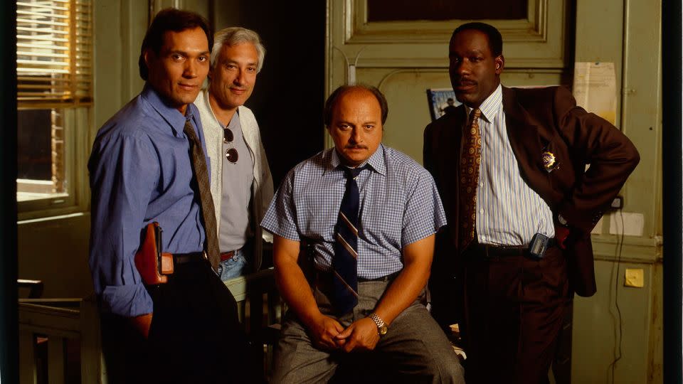 Jimmy Smits, co-creator Steven Bochco, Dennis Franz and James McDaniel on the set of "NYPD Blue" in 1994. - ABC Photo Archives/Getty Images