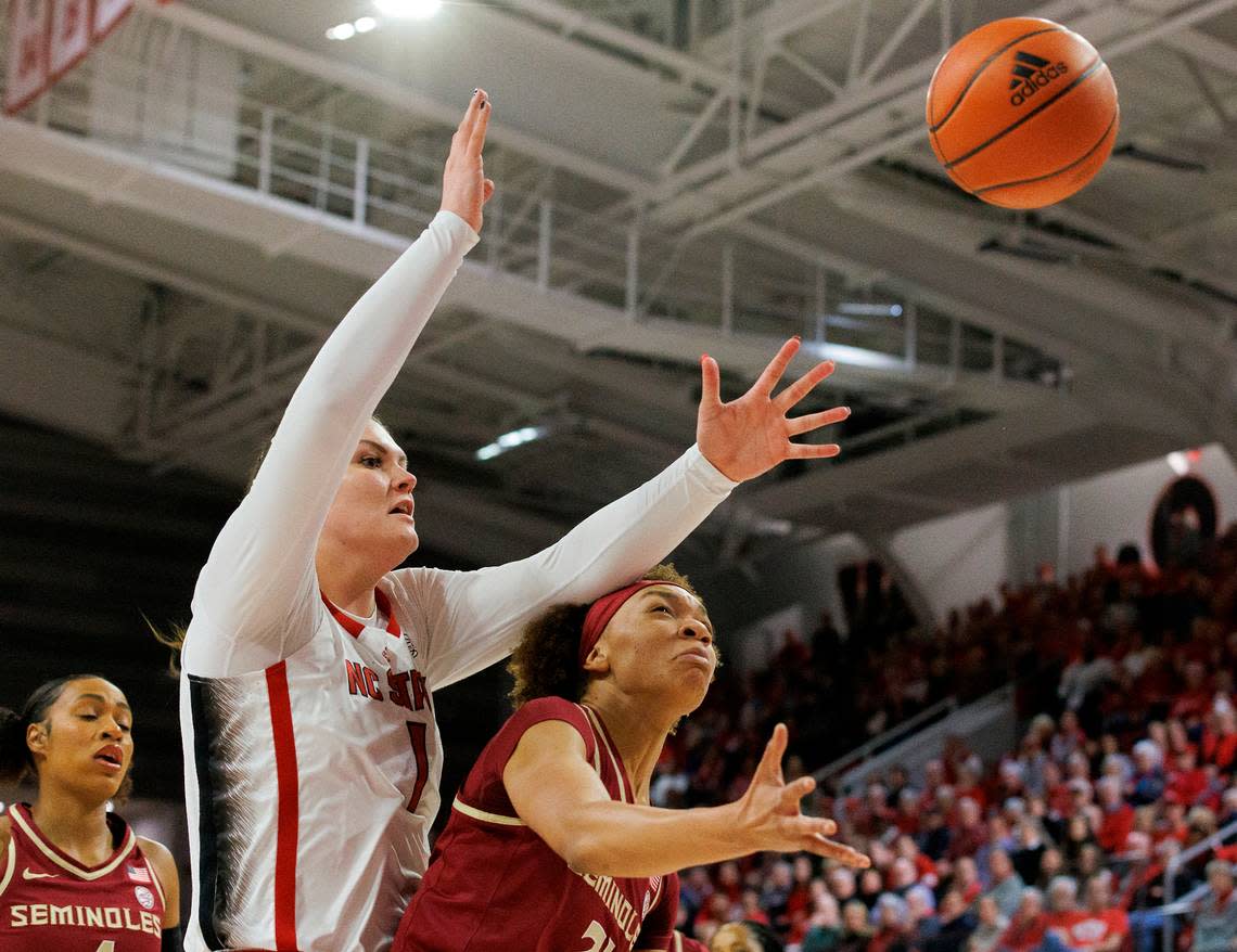 Florida State’s Makayla Timpson gets a rebound in front of N.C. State’s River Baldwin during the first half of the Wolfpack’s game on Thursday, Jan. 4, 2023, at Reynolds Coliseum in Raleigh, N.C.