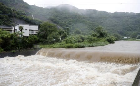 The Futami River is swollen due to heavy rain in Yatsushiro, Kumamoto Prefecture, southwestern Japan