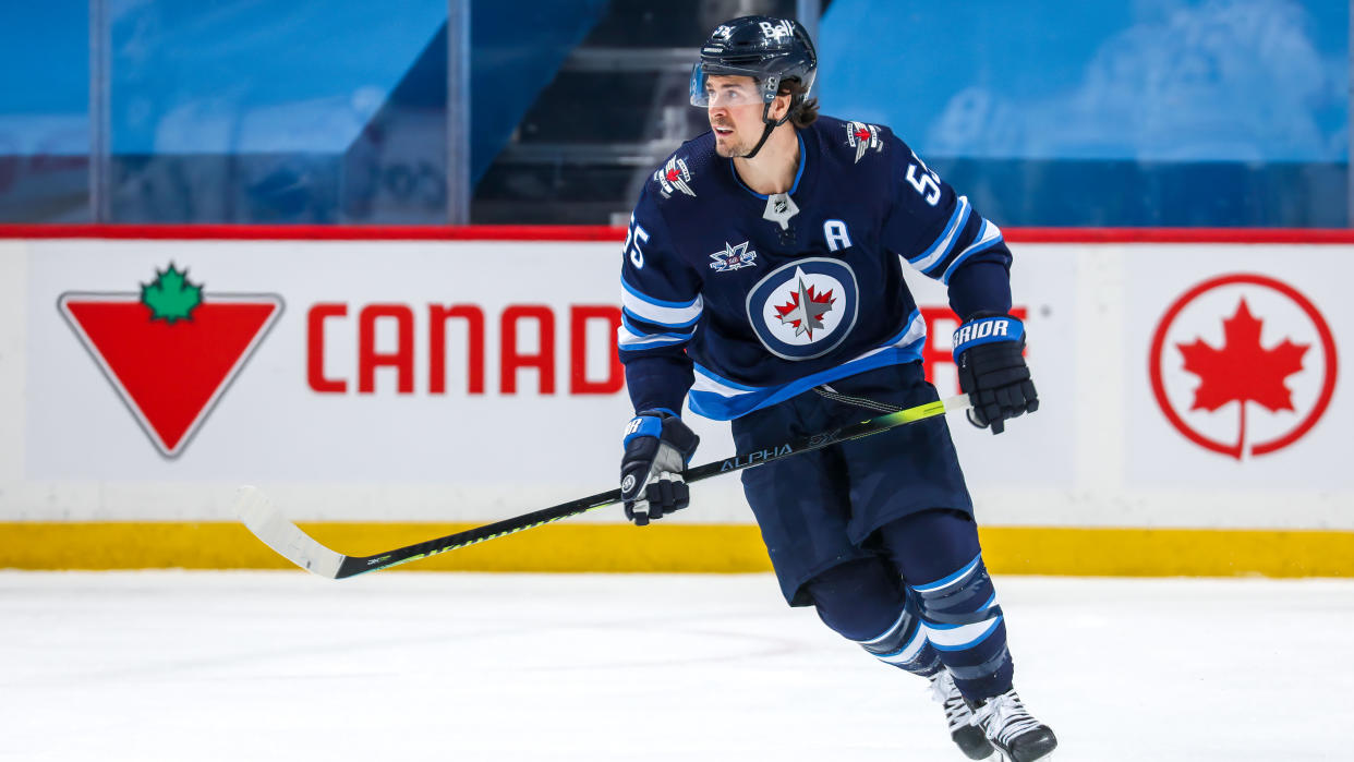 WINNIPEG, MB - FEBRUARY 27: Mark Scheifele #55 of the Winnipeg Jets keeps an eye on the play during first period action against the Montreal Canadiens at Bell MTS Place on February 27, 2021 in Winnipeg, Manitoba. (Photo by Jonathan Kozub/NHLI via Getty Images)