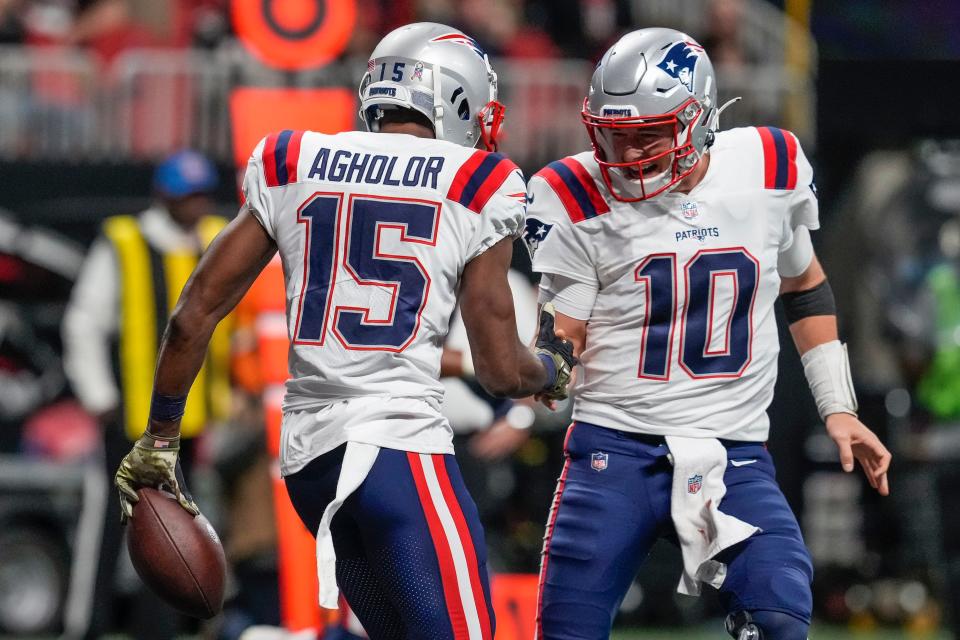 Patriots Nelson Agholor and Mac Jones celebrate after a firs-half touchdown against the Falcons.