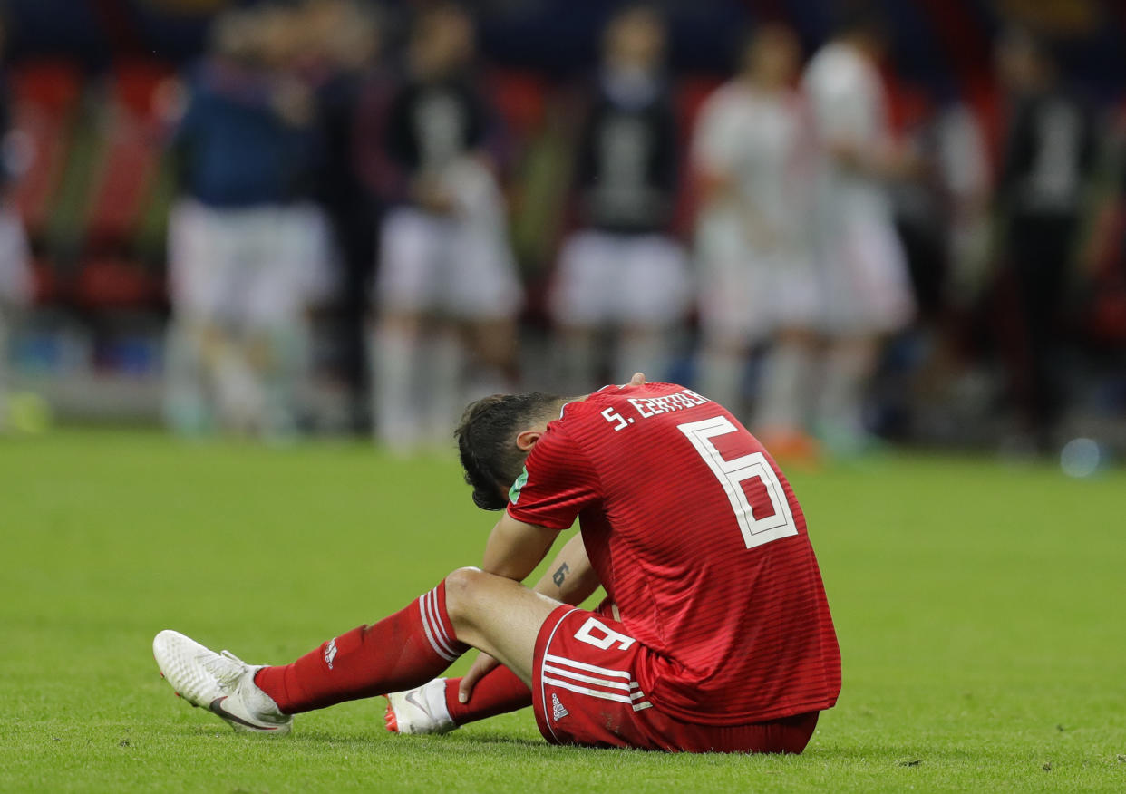 An Iran coach had to be hospitalized after officials ruled Iran’s Saeid Ezatolahi offside on an apparent equalizing goal against Spain. (AP)