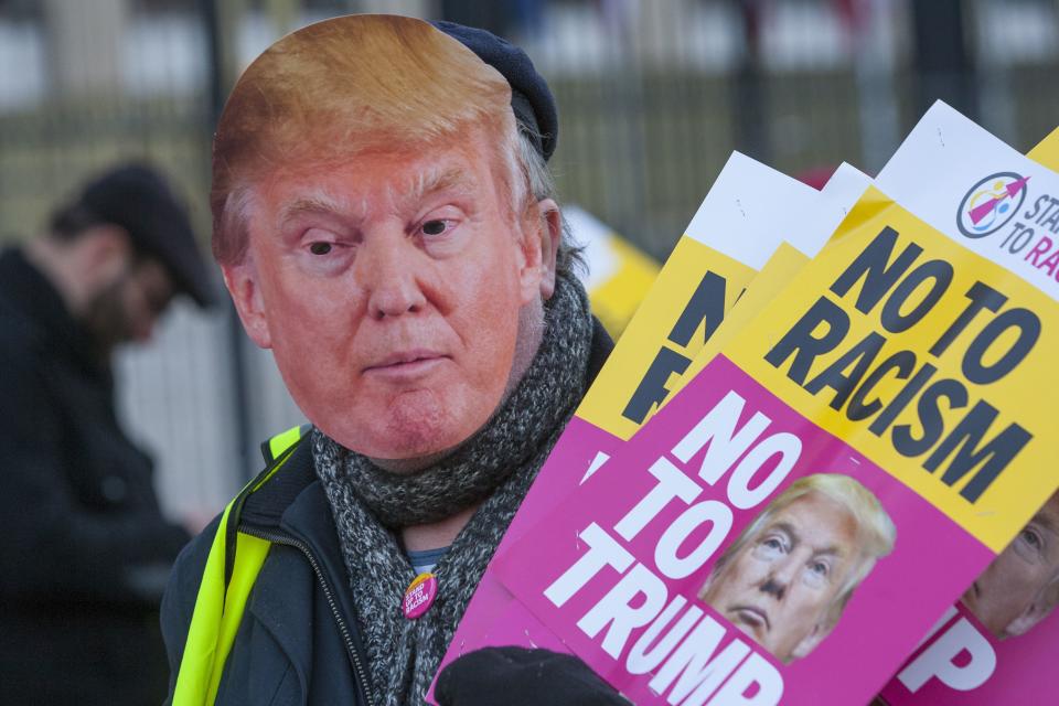 A man protesting against President Trump visiting the UK – 44% of Americans think Trump is racist.(Rex)