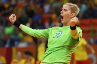 <p>Paula Ungureanu of Romania celebrates during the Womens Preliminary Group A match between Romania and Montenegro at Future Arena on August 10, 2016 in Rio de Janeiro, Brazil. (Photo by Lars Baron/Getty Images) </p>