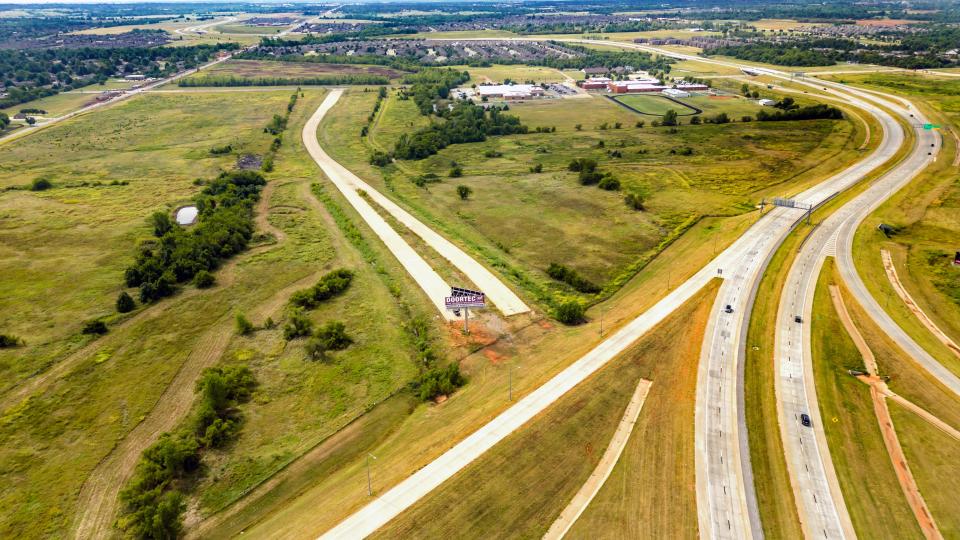 The location of the proposed Sunset Amphitheater on the abandoned stretch of the Kilpatrick Turnpike is shown in this photo.