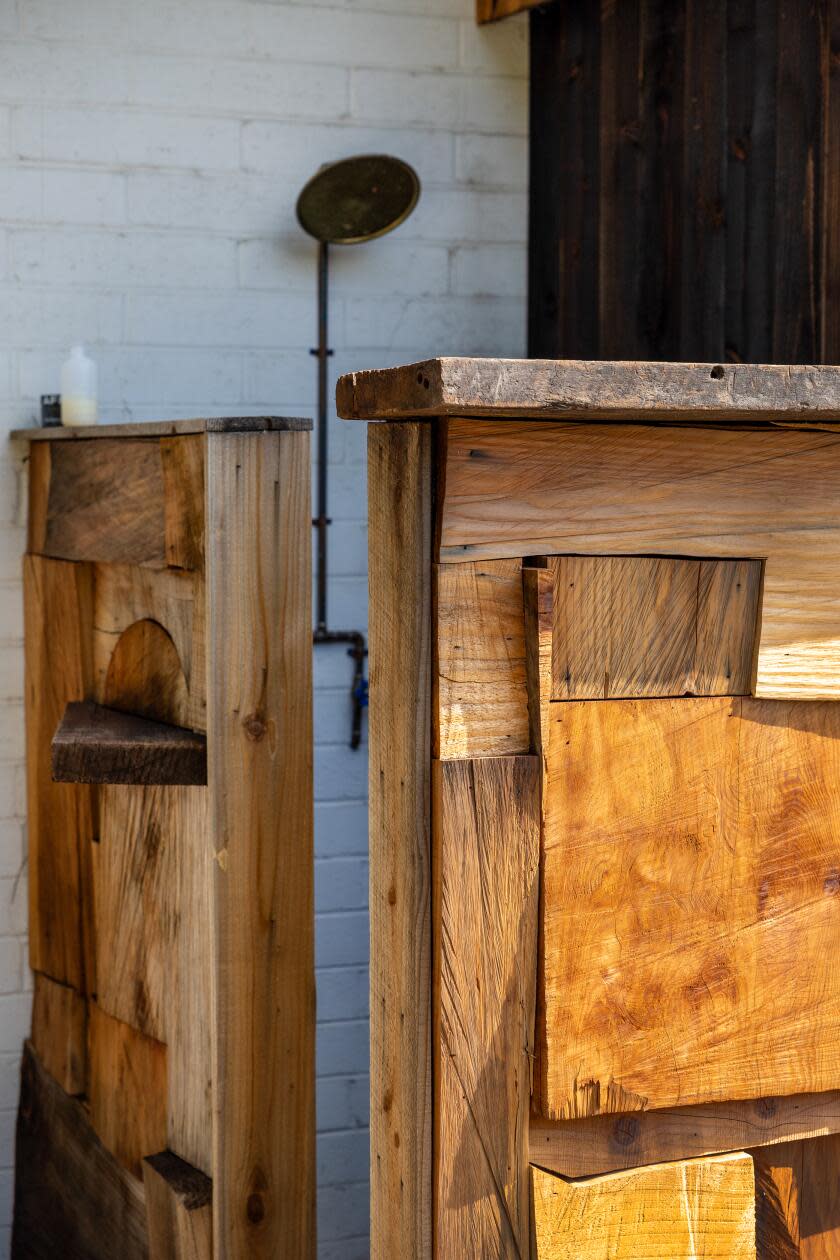 Detail of a wood mosaic outdoor shower made by Vince Skelly.