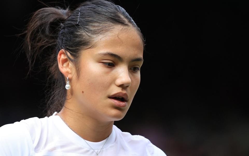 Emma Raducanu (GBR) looks on during Day One of The Championships Wimbledon 2022 at All England Lawn Tennis and Croquet Club - Getty Images