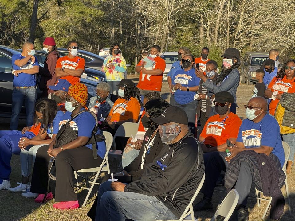 Friends and family gather at the New Springfield Baptist Church in Waynesboro, Ga., on Tuesday, Feb. 23, 2021, to mark the one year anniversary of Ahmaud Arbery's death in Brunswick, Ga. White men armed with guns pursued and killed Arbery, who is Black, as he ran through their neighborhood. (AP Photo/Lewis M. Levine)