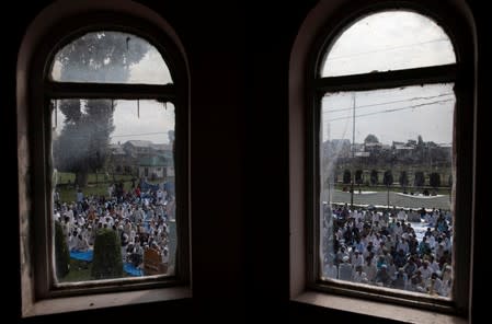 Kashmiris attend Eid-al-Adha prayers at a mosque during restrictions after the scrapping of the special constitutional status for Kashmir by the Indian government, in Srinagar