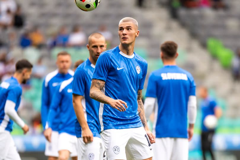 Benjamin Sesko warms up ahead of Slovenia's match against Armenia