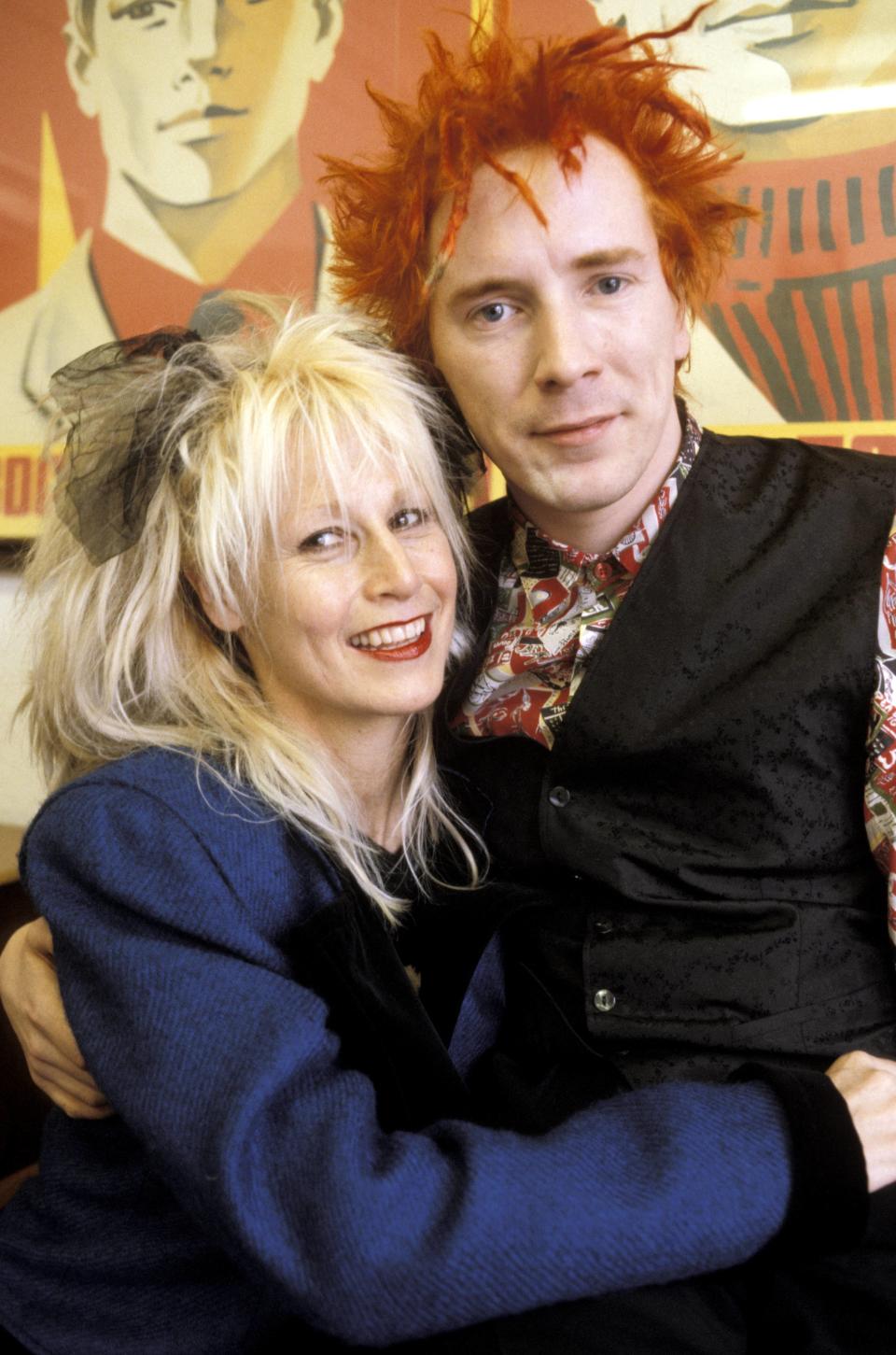 John Lydon posing with his wife Nora Forster. (Photo by Fin Costello/Redferns)