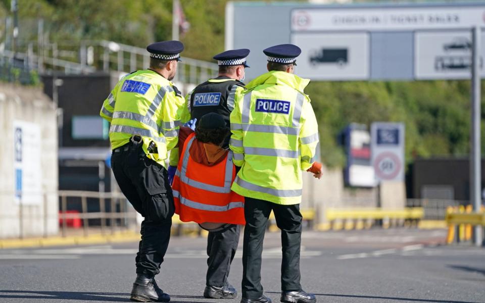 Police officers carry away a protester from Insulate Britain - Gareth Fuller /PA