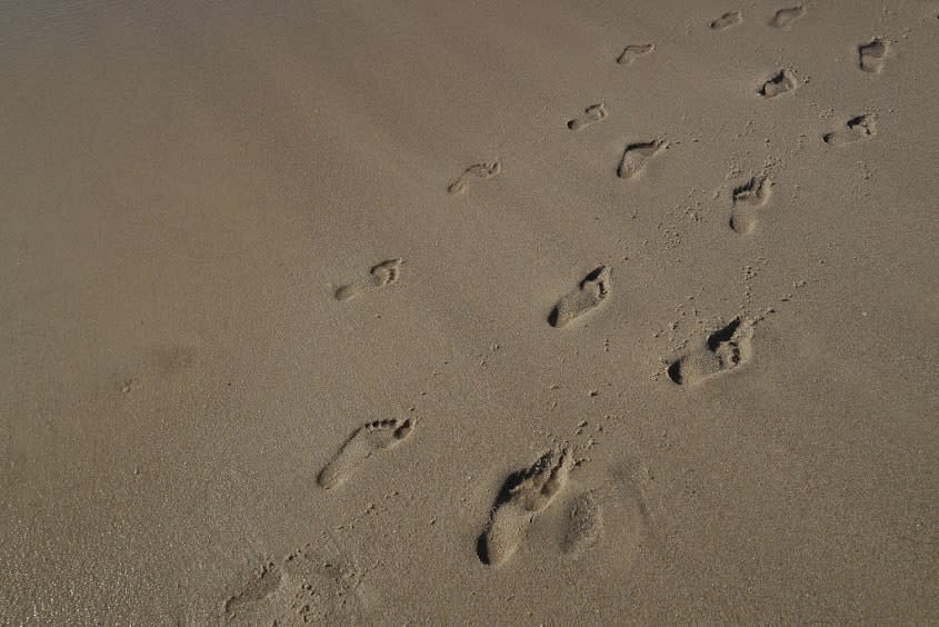 Footprints in sand.