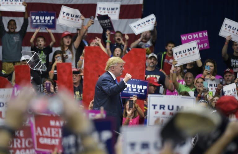 Republican presidential nominee Donald Trump makes his way off stage after a rally at the Cambria County War Memorial Arena in Johnstown, Pennsylvania