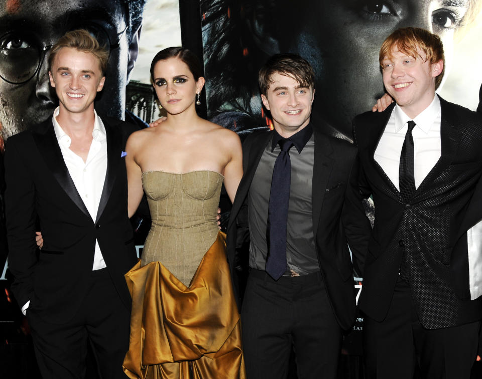 harry potter cast members, from left, Tom Felton, Emma Watson, Daniel Radcliffe and Rupert Grint pose together at the premiere of "Harry Potter and the Deathly Hallows: Part 2" at Avery Fisher Hall in New York. The film is the eighth and final film in the Harry Potter series. (AP Photo/Evan Agostini, file)