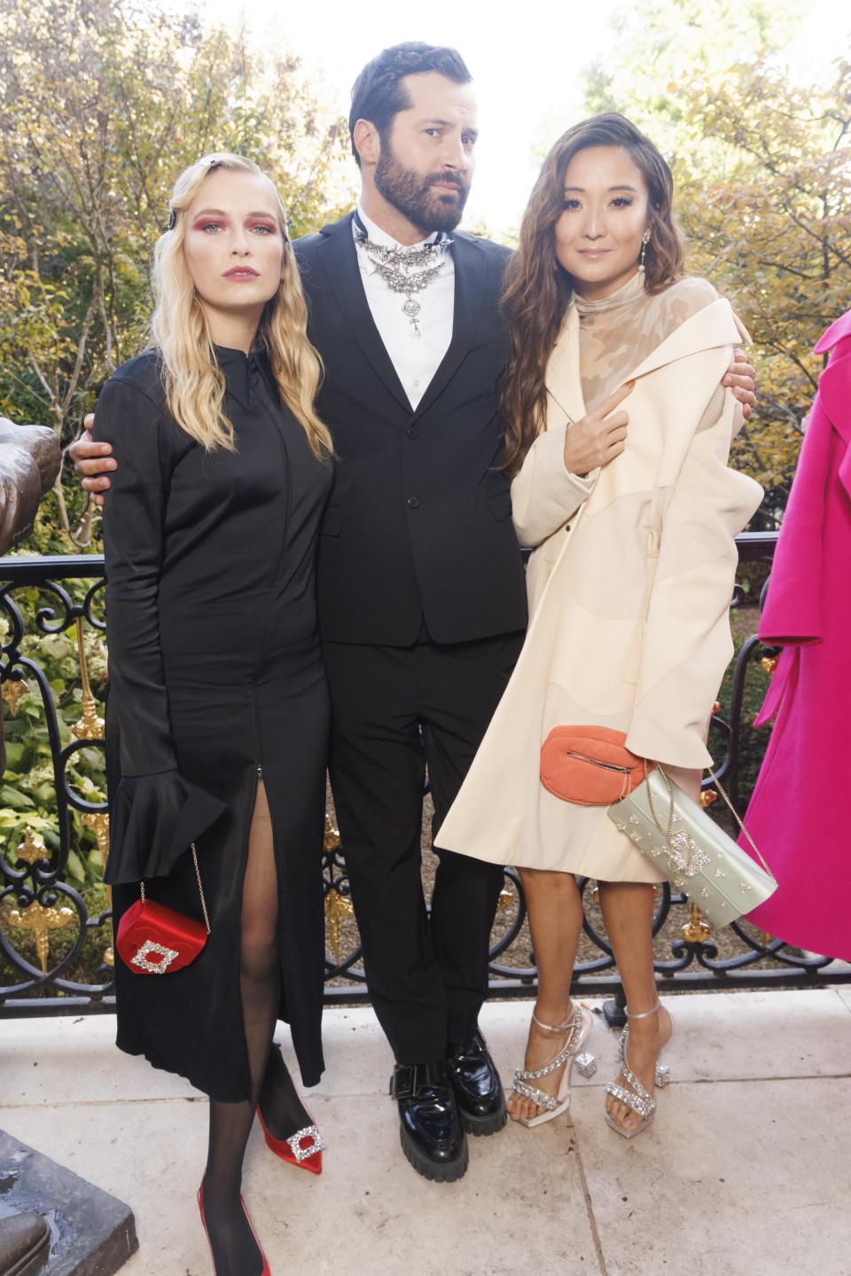 Roger Vivier creative director Gherardo Felloni with actresses Camille Razat (left) and Ashley Park, both of the hit Netflix show “Emily in Paris.” - Credit: Courtesy of Roger Vivier