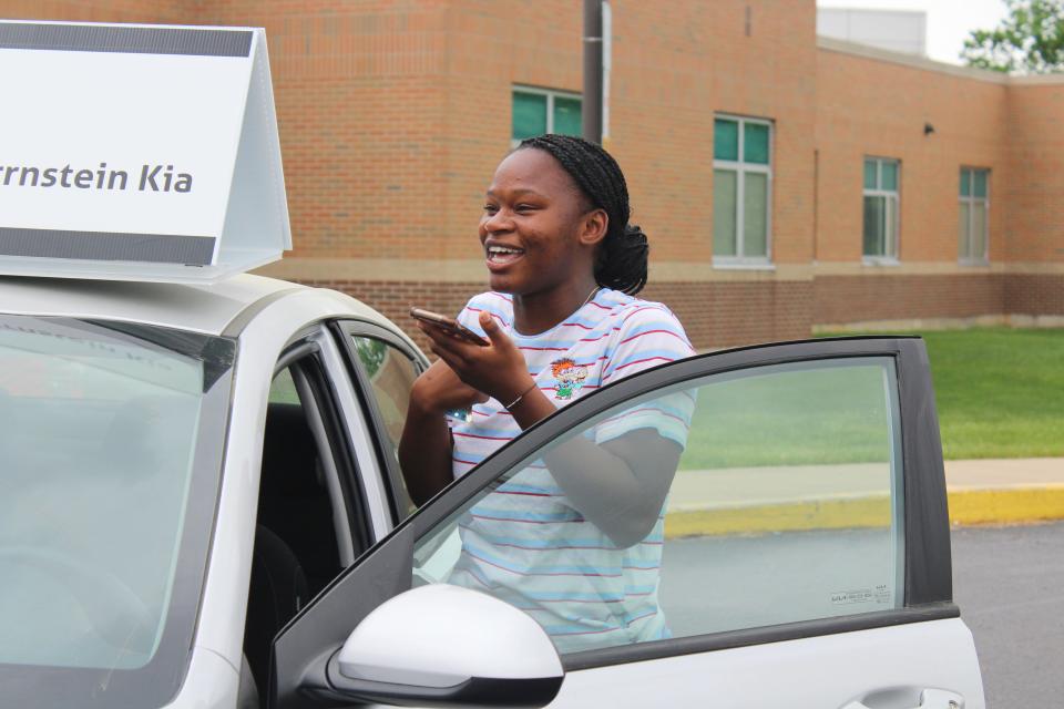 Student Kendra Allen and her classmates celebrate in the auditorium of Chillicothe High School after she won a new car from Herrnstein Auto as part of the Keys to Success program on May 8, 2023. Allen called her mom to tell her the news.