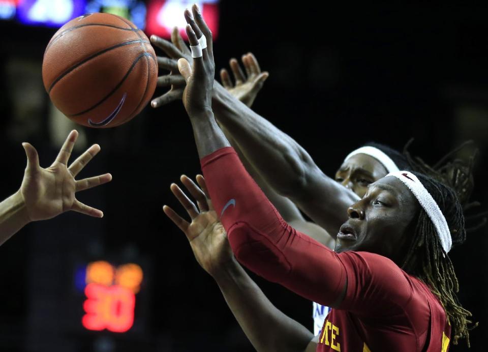 Iowa State forward Solomon Young, front, rebounds against Kansas State forward D.J. Johnson, back, during the second half of an NCAA college basketball game in Manhattan, Kan., Wednesday, Feb. 15, 2017. (AP Photo/Orlin Wagner)