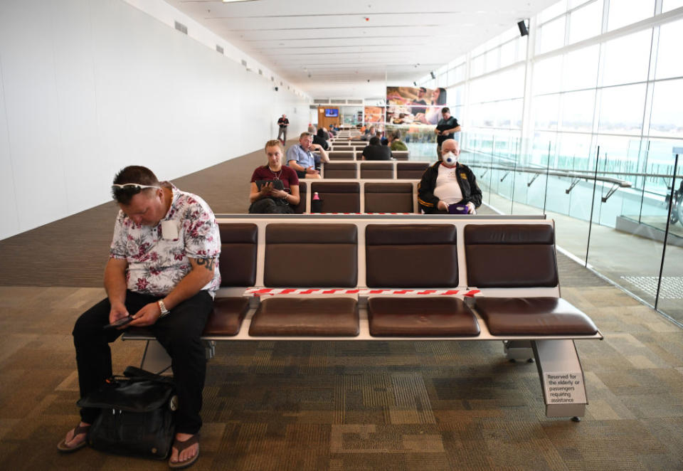 Passengers observe social distancing as they wait for a Qantas flight at Adelaide Airport on Wednesday. Source: Getty