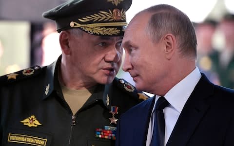 Russian President Vladimir Putin, right, and Russian Defense Minister Sergei Shoigu - Credit: Alexei Nikolsky