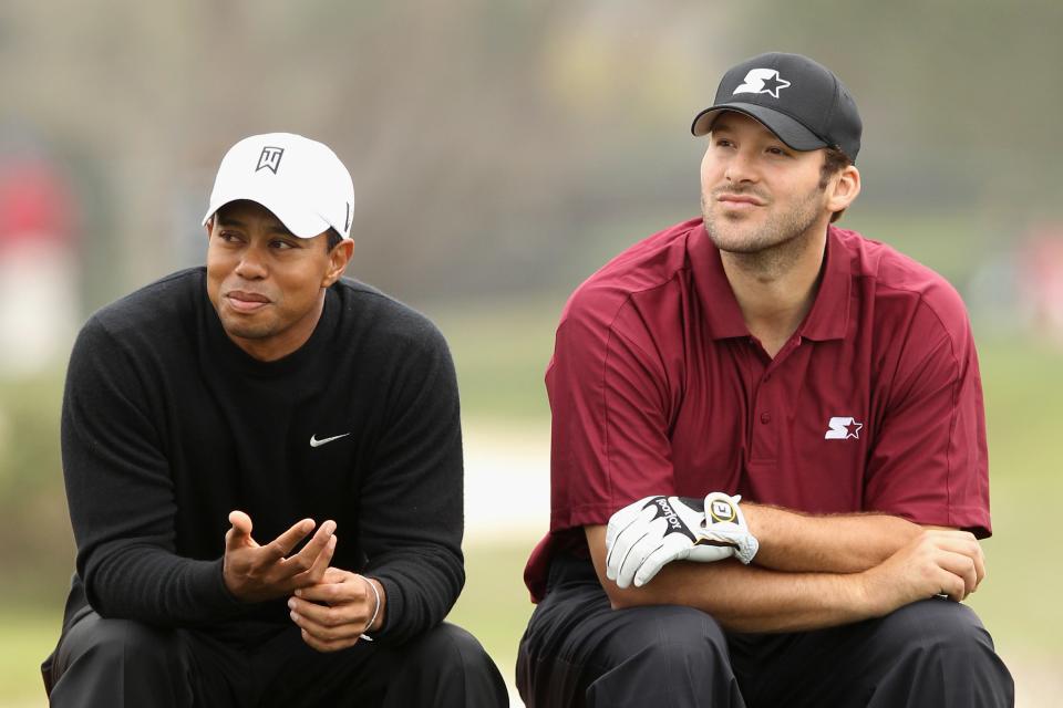 PEBBLE BEACH, CA - FEBRUARY 10:  (L-R) Tiger Woods and NFL football quarterback for the Dallas Cowboys, Tony Romo wait on the sixth tee during the second round of the AT&T Pebble Beach National Pro-Am at the Monterey Peninsula Country Club (Shore Course) on February 10, 2012 in Pebble Beach, California.  (Photo by Ezra Shaw/Getty Images)