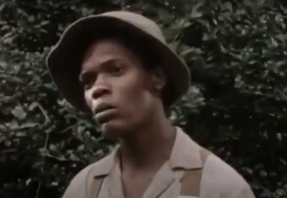 closeup of samuel wearing a bucket hat standing outside