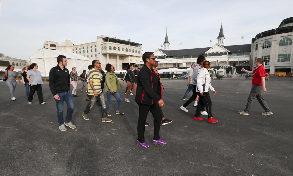 Mutuel manager Gene Grieshaber, right, conducts a tour of Churchill Downs before a training session for new mutuel clerks in Louisville, Ky. on Apr. 19, 2023.  The track will need additional clerks as the Kentucky Derby approaches.