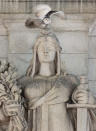 A rare snowy owl takes flight from its' perch atop the Louis St. Gaudens's allegorical Themis statue, representing freedom and justice, on the parapet above the entrance of Union Station in Washington, Saturday, Jan. 8, 2022. (AP Photo/Carolyn Kaster)