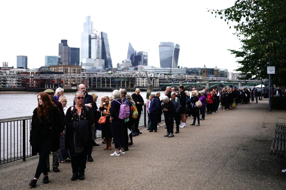 Members of the public in the queue on the South Bank (PA)