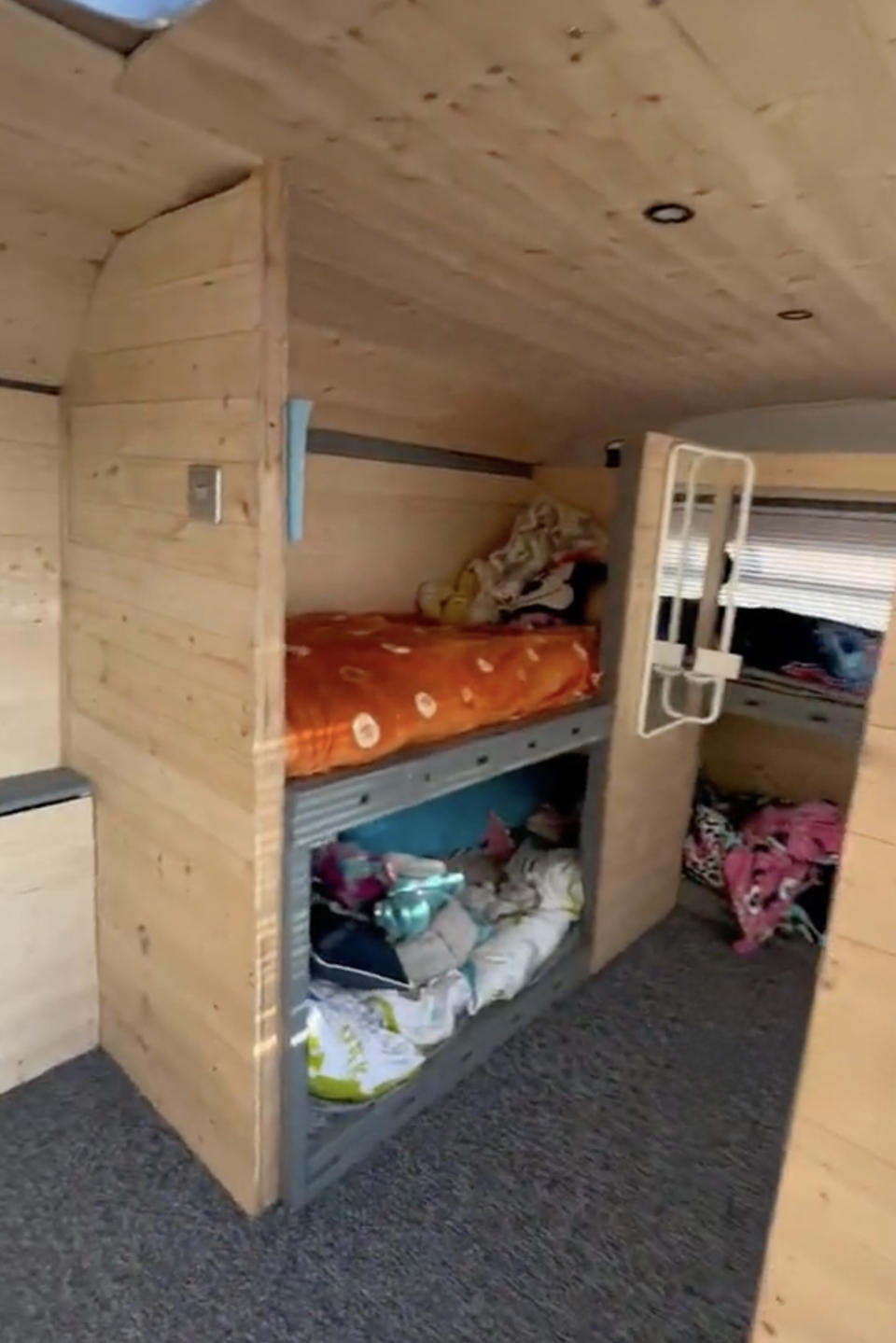 A set of children's bunk beds on board the double decker bus. (SWNS)
