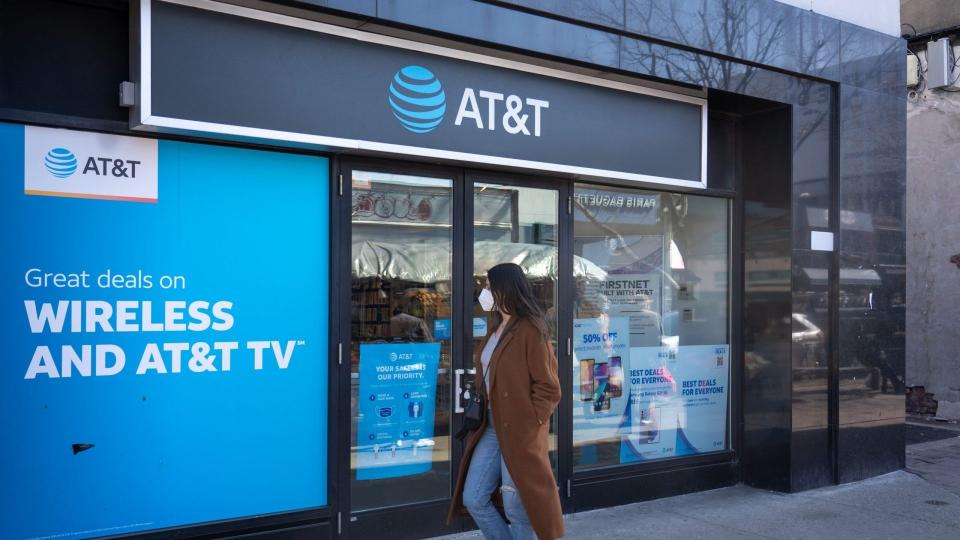 Mandatory Credit: Photo by Ron Adar/SOPA Images/Shutterstock (11793501e)A woman wearing a face mask looks at a store window of an AT&T Wireless store in Queens.