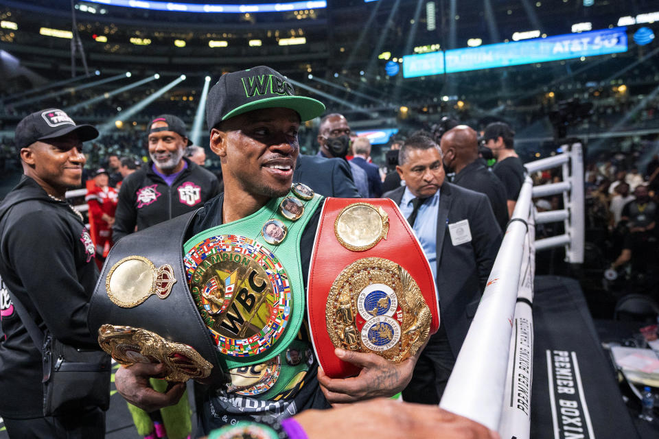 Errol Spence Jr. acknowledges fans after defeating Yordenis Ugas, from Cuba, in a world welterweight championship boxing match Saturday, April 16, 2022, in Arlington, Texas. (AP Photo/Jeffrey McWhorter)