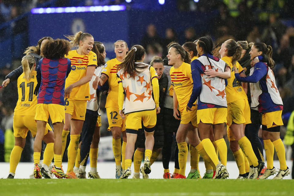 Barcelona's Fridolina Rolfo, fourth left, and her teammates celebrate after the Women's Champions League, semi final second leg, soccer match between FC Chelsea and FC Barcelona in London, England, Saturday, April 27, 2024. (Zac Goodwin/PA via AP)