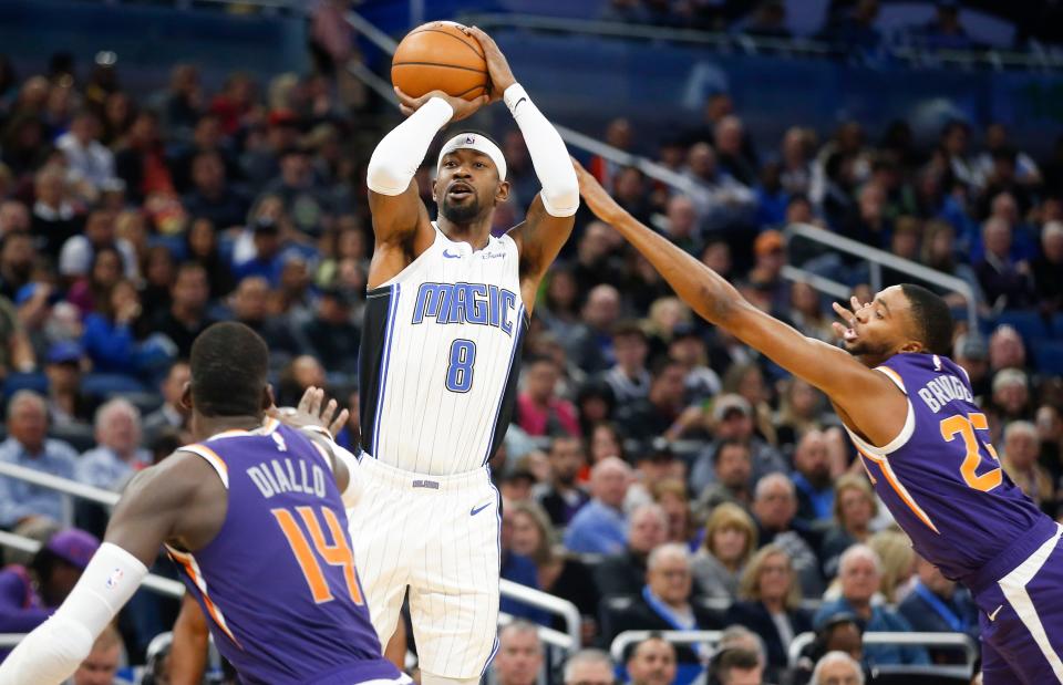 Dec 4, 2019; Orlando, FL, USA; Orlando Magic guard Terrence Ross (8) shoots over Phoenix Suns forward Cheick Diallo (14) and  forward Mikal Bridges (25) during the second quarter at Amway Center. Mandatory Credit: Reinhold Matay-USA TODAY Sports