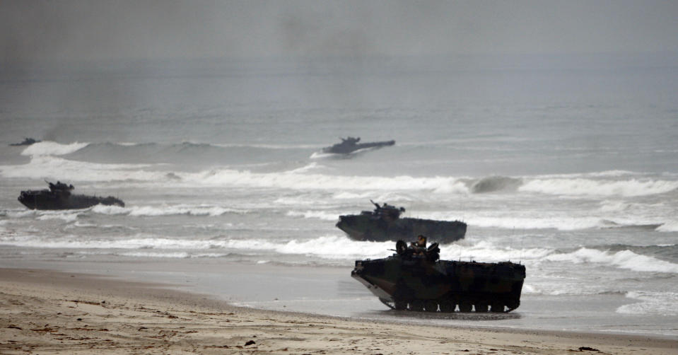 FILE - In this Friday June 2, 2010 file photo, Amphibious Assault Vehicles storm Red Beach during exercises at Camp Pendleton, Calif. Marines are training in seafaring tanks for the first time since nine men died when when one of the troop carriers sank off the Southern California coast during an exercise on July 30, 2020. The Orange County Register reports Marines from Camp Pendleton resumed exercises in water recovery and troop transfers, without troops in early April 2021. The Marine Corps has said that last year's accident was caused by inadequate training, shabby maintenance and poor judgment by commanders. (AP Photo/Lenny Ignelzi, File)