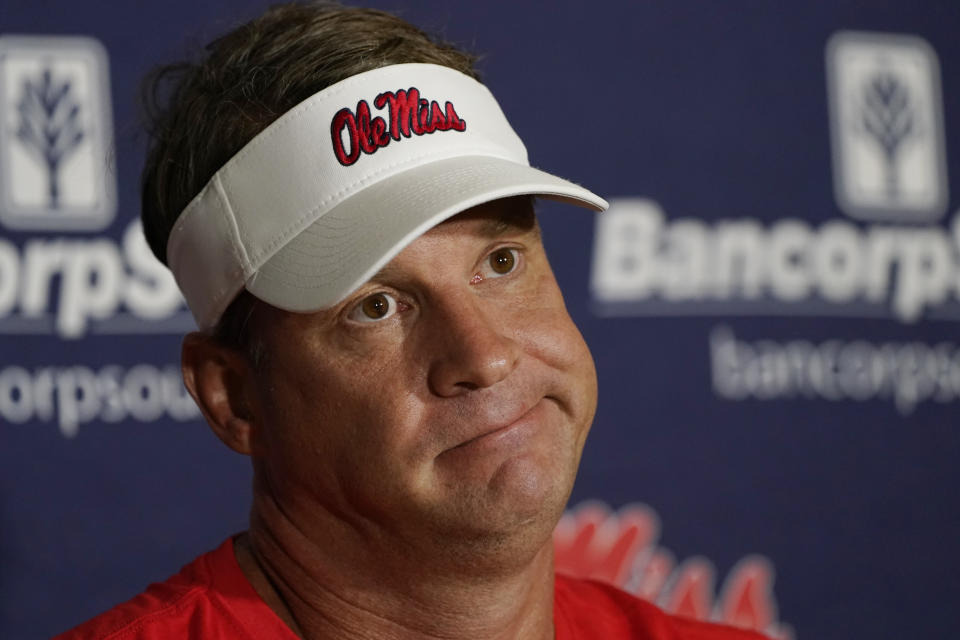 Mississippi coach Lane Kiffin ponders a reporter&#39;s question during a news conference before the college football season. (AP Photo/Rogelio V. Solis)