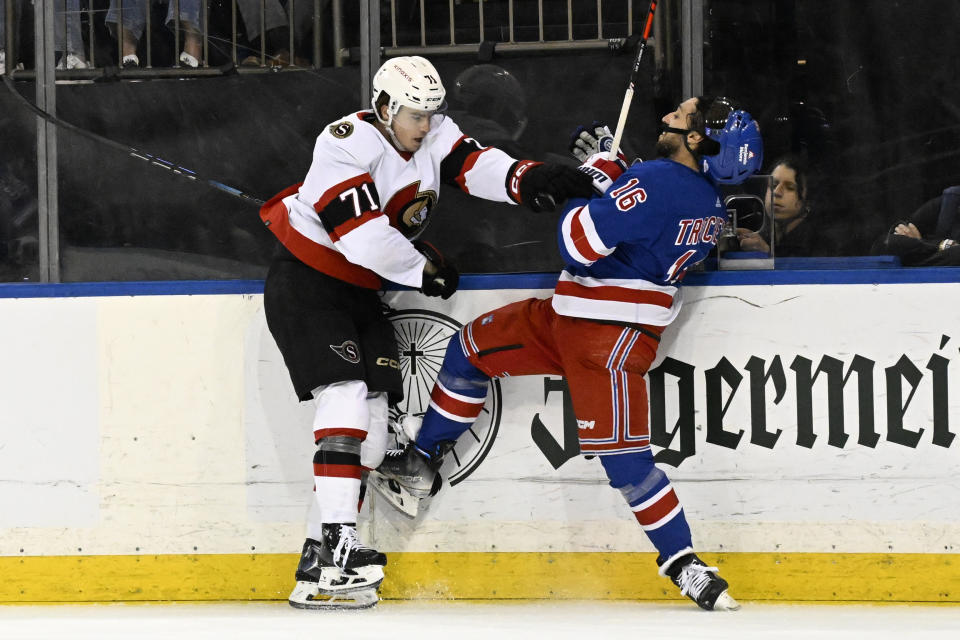 Ottawa Senators center Ridly Greig (71) checks New York Rangers center Vincent Trocheck (16) during the first period of an NHL hockey game Monday, April 15, 2024, at Madison Square Garden in New York. (AP Photo/Bill Kostroun)