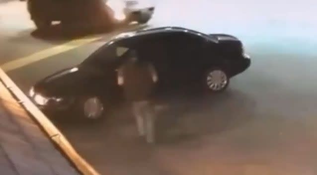 The car owner notices his car is being stolen when he walks out the shop and he runs over. Photo: YouTube