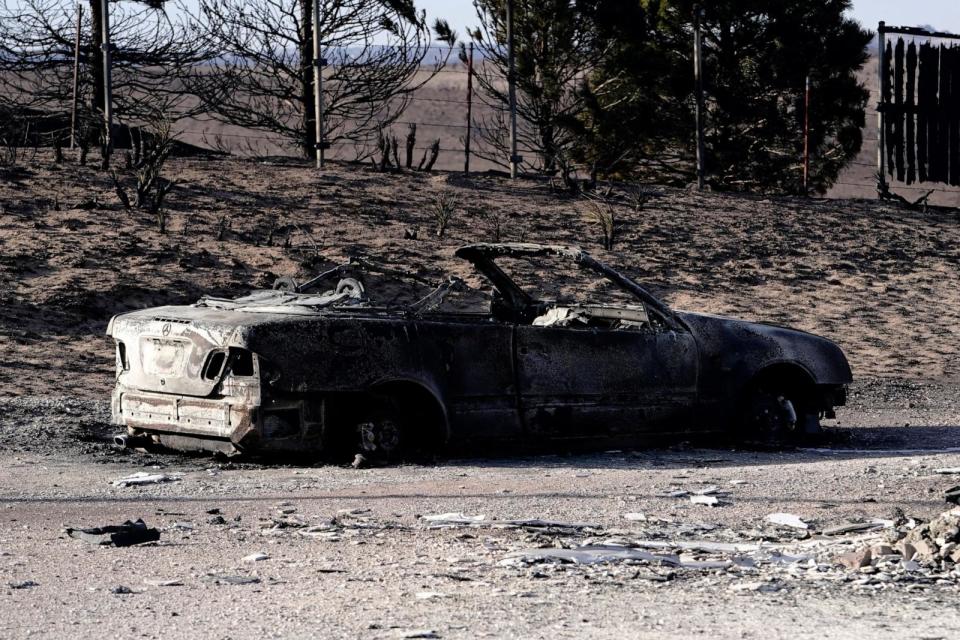 PHOTO: The remains of a vehicle sit in the driveway of a home that was destroyed by the Smokehouse Creek wildfire in Canadian, Texas, Feb. 28, 2024.  (Nick Oxford/Reuters)