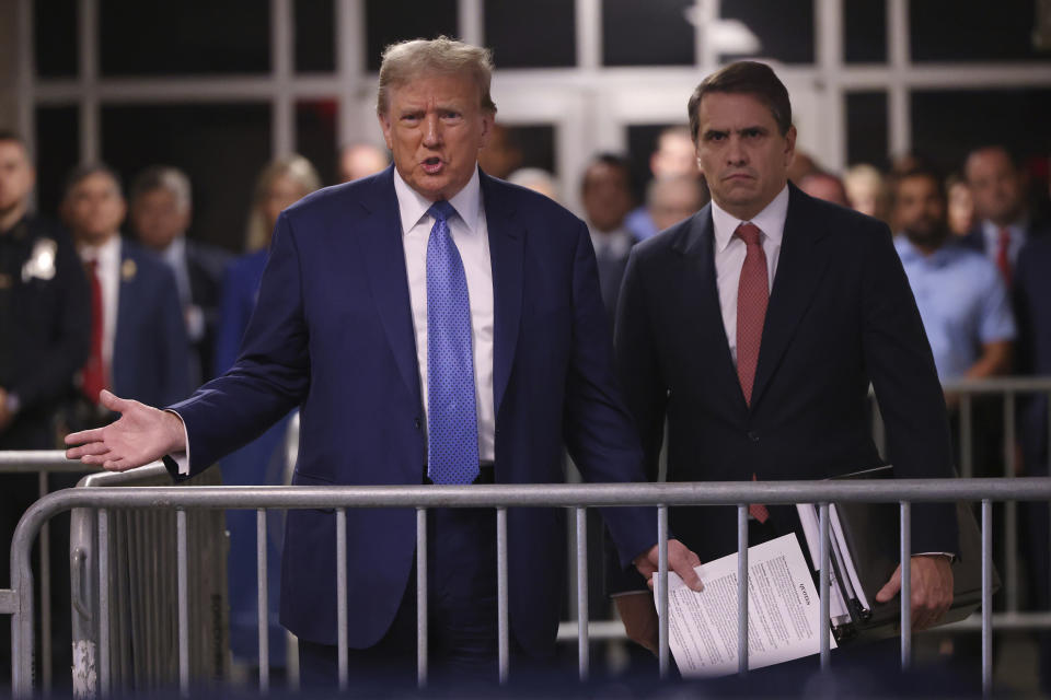 Former President Donald Trump speaks to members of the media before entering the courtroom with his attorney Todd Blanche at Manhattan Criminal Court on Monday, May 20, 2024 in New York. (Michael M. Santiago/Pool Photo via AP)