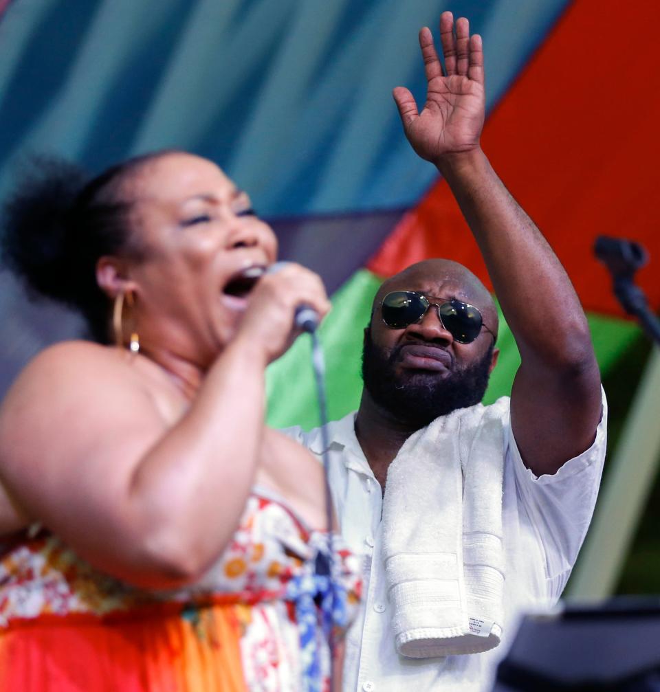 Rod Porter reacts as Chanda Graham sings during the "1969" concert, the culmination of a three-day celebration of the 50th anniversary of Woodstock, at the Myriad Gardens in Oklahoma City, Saturday, Aug. 17, 2019.